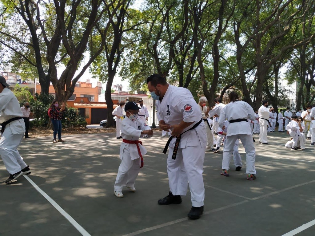 An instructor correcting a child’s stance