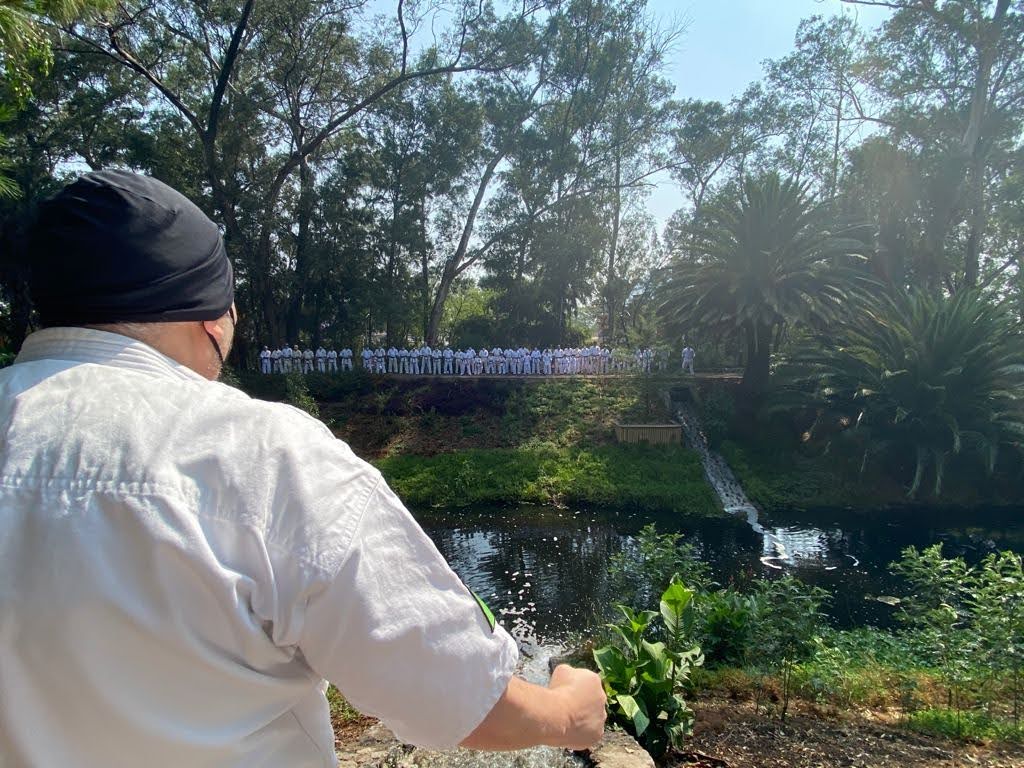 An instructor watching the formation across the pond