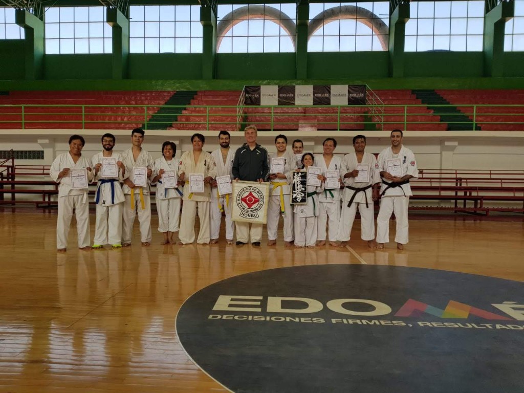 Participants with certificates and the Honbu flag after the grading