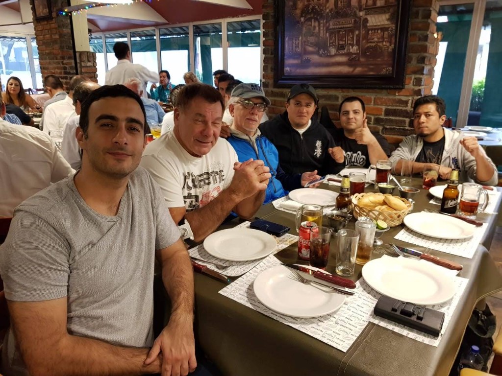 Instructors and participants sharing a meal after the October 2018 seminar and grading